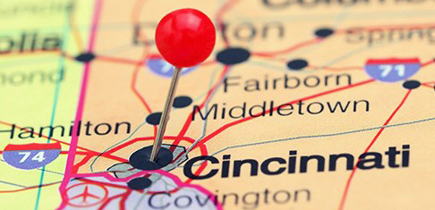 Photo of pinned Cincinnati on a map of USA. May be used as illustration for travelling theme.
